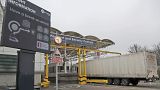 Lorries pass the customs checkpoint at the Eurotunnel train link with Europe in Folkestone, England, on Jan. 1, 2021.