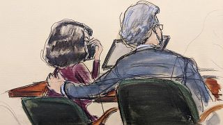 A courtroom sketch shows Ghislaine Maxwell (L) with her lawyer Jeffrey Pagliuca, as a jury returns a guilty verdict in her sex trafficking trial, New York, Dec. 29, 2021.