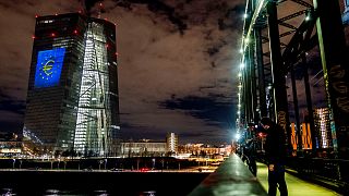 A light installation is projected onto the building of the European Central Bank during a rehearsal in Frankfurt, Germany, Thursday, Dec. 30, 2021.