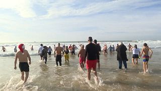 Swimmers near Lisbon brave traditional new year's sea dip