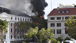 A fire burns at the Houses of Parliament, in Cape Town, South Africa, Jan. 2, 2022.