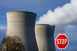 Steam rises from the cooling tower of the nuclear power plant of Gundremmingen, Bavaria, Friday, Dec. 31, 2021.