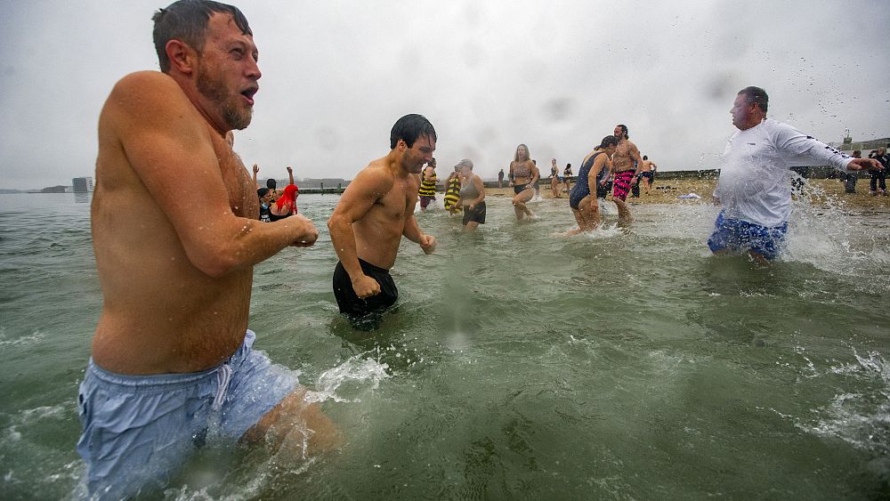 Boston swimmers aren’t shy with their first swim of the year