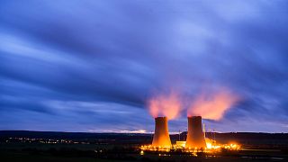 Steam rises from the cooling towers of the Grohnde nuclear power plant near Grohnde, Germany, Wednesday, Dec. 29, 2021.