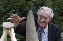 Richard Leakey, Kenyan wildlife conservationist, places a rhino horn to be burned at the zoo in Dvur Kralove, Czech Republic, Tuesday, Sept. 19, 2017.