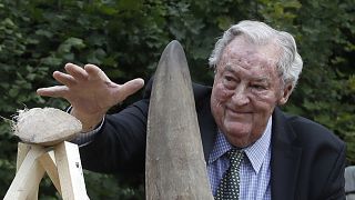 Richard Leakey, Kenyan wildlife conservationist, places a rhino horn to be burned at the zoo in Dvur Kralove, Czech Republic, Tuesday, Sept. 19, 2017.