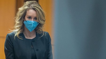 Elizabeth Holmes walks into federal court in San Jose, Calif., Jan. 3, 2022.