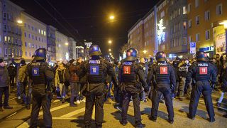 Police officers block protesters on Monday evening in the city centre of Magdeburg.