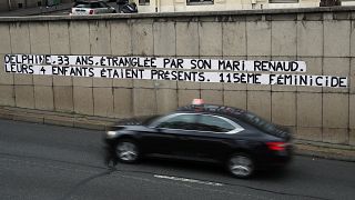 Posters read "Delphine, 33, strangled by her husband Reanud. Their four children were present. 115th feminicide" in Paris, Wednesday, Nov. 6, 2019.