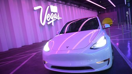 A Tesla Inc. electric vehicle waits to transport passengers through the Las Vegas Convention Center Loop ahead of the Consumer Electronics Show (CES)