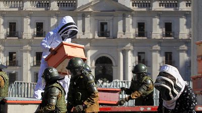Beekeepers who demanded government measures to face the persistent drought take part in a protest with honeycombs full of bees in front of Chilean Presidential Palace