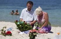 Mourners on the site of the 2015 terror attack on a beach in Tunisia.