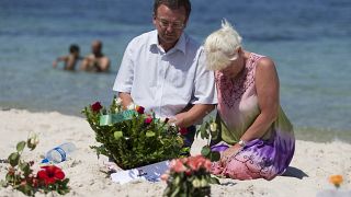 Mourners on the site of the 2015 terror attack on a beach in Tunisia.