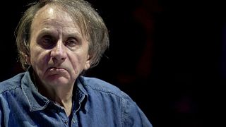 This file photo taken on April 25, 2019 shows French writer Michel Houellebecq taking part in a debate "Dialogue in Europe" in Paris.