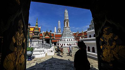 Tourists visit Grand Palace in Bangkok, Thailand.