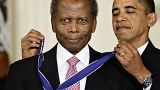 President Barack Obama presents the 2009 Presidential Medal of Freedom to Sidney Poitier during ceremonies in the East Room at the White House in Washington on, Aug. 12, 2009