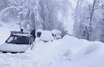 Vehicles trapped in a heavy snowfall-hit area in Murree