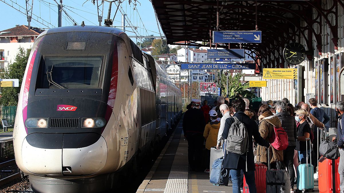 Passengers wait next TGV to Paris at the Saint Jean de Luz train station, Saturday, Oct. 31, 2020.