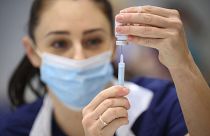 A medical staffer prepares a shot of Moderna COVID-19 vaccine, at a vaccination center in Ramsgate, England, Thursday, Dec. 16, 2021.