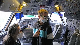 9-year old Niklas gets a view into the cockpit after he was vaccinated inside an Airbus A300 Zero G plane.