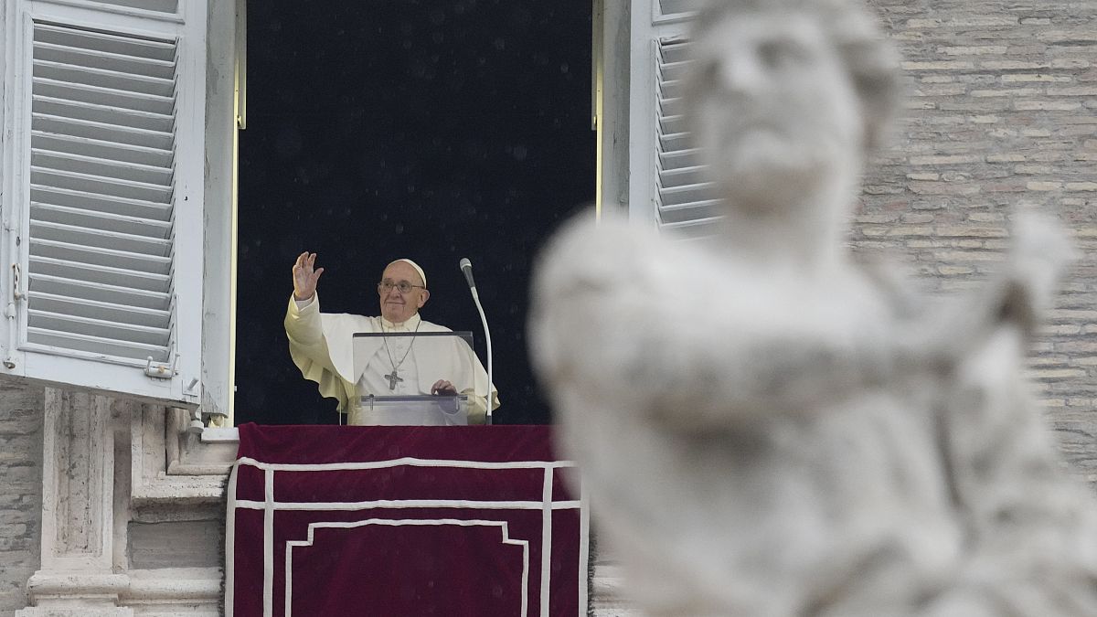 Pope Francis delivers the Angelus noon prayer in St.Peter's Square, at the Vatican, Sunday, Jan. 9, 2022. 