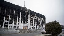 A general view of a burnt-out Almaty City Administration building in central Almaty, following violent protests.