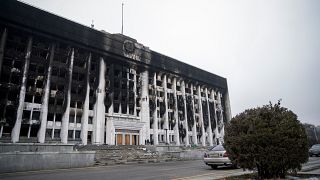 A general view of a burnt-out Almaty City Administration building in central Almaty, following violent protests.