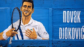 A mural depicting Serbian tennis player Novak Djokovic on a wall in Belgrade, Serbia, Thursday, Jan. 6, 2022.