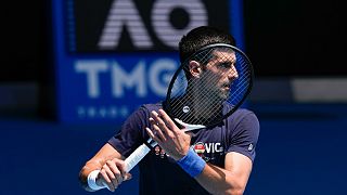 Defending men's champion Serbia's Novak Djokovic practices on Rod Laver Arena ahead of the Australian Open tennis championship in Melbourne, Australia, Jan. 12, 2022.