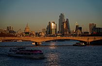 The skyline of the financial district known as The City, as the sun sets in London, Tuesday, Nov. 23, 2021.