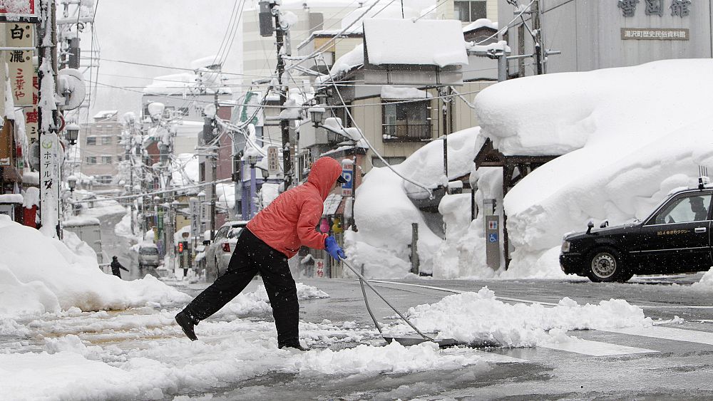 Snowstorms hit Japan`s northern Hokkaido and northeastern region of Tohoku thumbnail