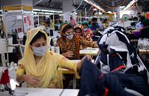 Garment employees work in the sewing section of a factory in Savar, Bangladesh.