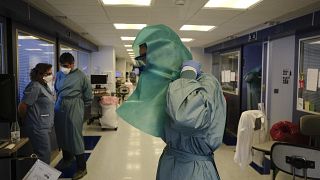A member of the medical team wearing PPE in the ICU department of the Clinica Universitaria in Pamplona.
