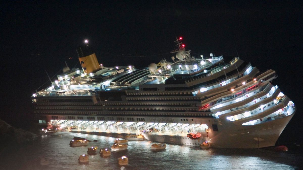 The luxury cruise ship Costa Concordia lays on its starboard side after it ran aground off the coast of the Isola del Giglio island, Italy on Jan. 13, 2012.