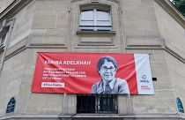 The portrait of French-Iranian academic Fariba Adelkhah, who has been detained in Iran since June 2019, is displayed on the Paris Centre town hall building.