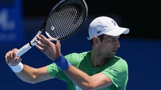 Defending men's champion Serbia's Novak Djokovic practices on Margaret Court Arena ahead of the Australian Open tennis championship in Melbourne, Australia, Jan. 13, 2022.