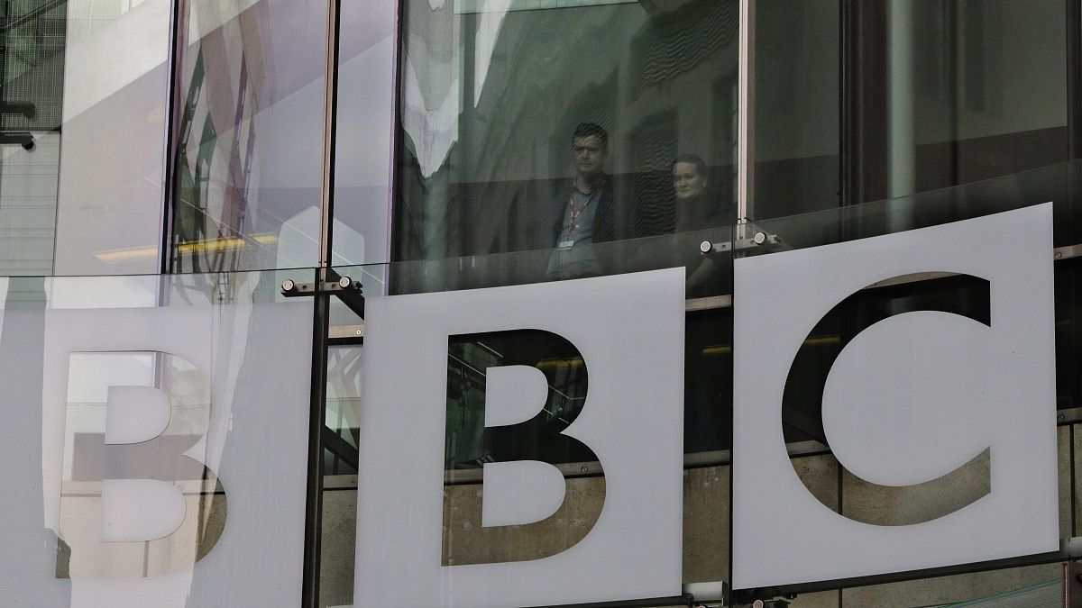 In this Thursday, March 28, 2013 file photo, people look out from inside BBC's New Broadcasting House, in central London
