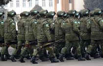 Peacekeepers of the Collective Security Treaty Organization attend a ceremony in Almaty.