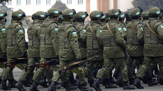 Peacekeepers of the Collective Security Treaty Organization attend a ceremony in Almaty.