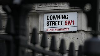 A Downing Street sign is fixed at the entrance in London, Tuesday, Jan. 11, 2022.