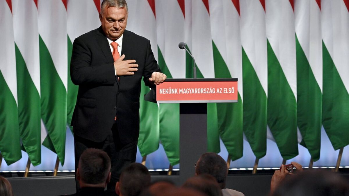 Hungarian prime minister Viktor Orban responds to applause as he takes to the stage to addresses the 29th congress of Fidesz in Budapest, November 2021