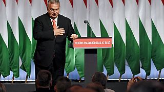 Hungarian prime minister Viktor Orban responds to applause as he takes to the stage to addresses the 29th congress of Fidesz in Budapest, November 2021