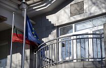 Lithuanian and European Union flags fly outside the Lithuanian Embassy in Beijing, Thursday, Dec. 16, 2021. 