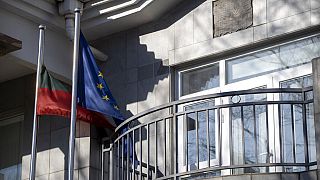 Lithuanian and European Union flags fly outside the Lithuanian Embassy in Beijing, Thursday, Dec. 16, 2021. 