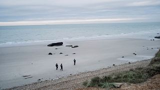 Police officers patrol on the beach in the searcher migrants in Wimereux, northern France.