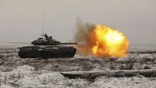 A Russian tank T-72B3 fires as troops take part in drills at the Kadamovskiy firing range in the Rostov region in southern Russia, on Jan. 12, 2022.