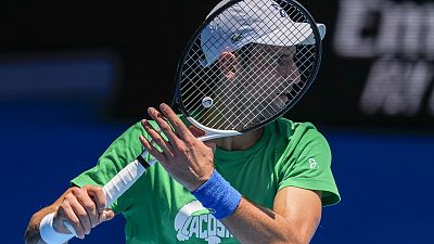 Serbia's Novak Djokovic practices on Margaret Court Arena ahead of the Australian Open tennis championship in Melbourne