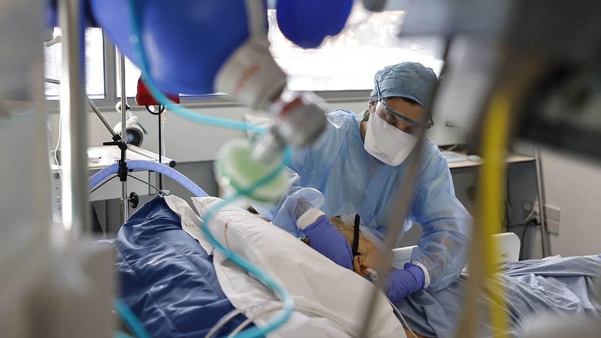 A medical staff member tends to a COVID-19 patient in the intensive care unit of the Strasbourg University Hospital