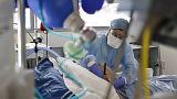 A medical staff member tends to a COVID-19 patient in the intensive care unit of the Strasbourg University Hospital