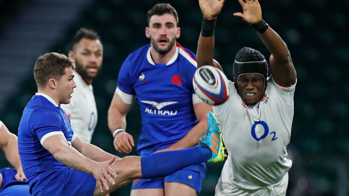 England's Maro Itoje tries to charge down a kick from Antoine Dupont of France during the Six Nations rugby union match  at Twickenham Stadium, London, March 13, 2021.